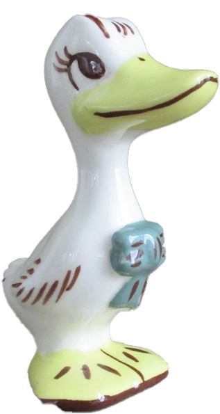 a porcelain statuette of a smiling duck