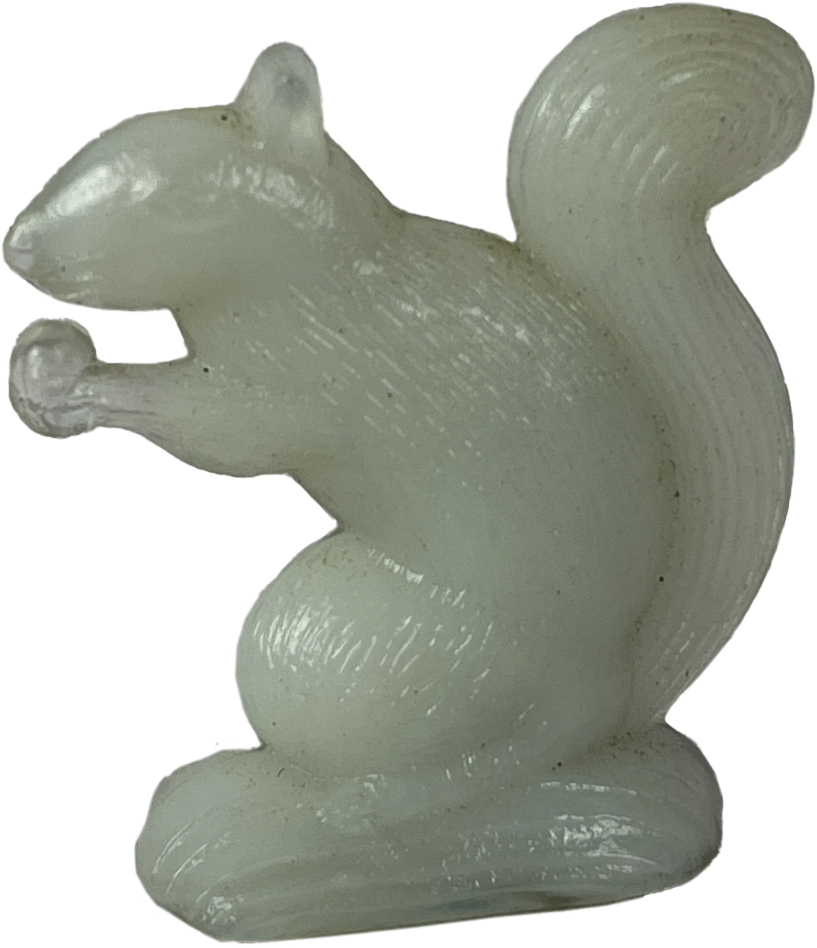 a soap stone statuette of white squirrel